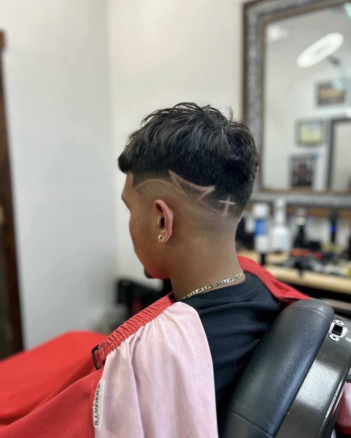 Bowl cut with shaved line design and fade at Sayless Fadez